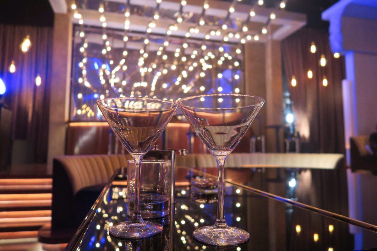 Martini glasses placed on a luxurious bar.