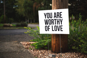Sign stating "You are worthy of love."